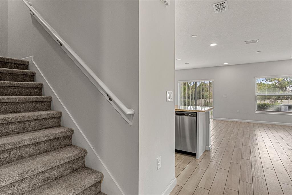 2875 Narcoossee Cmns Way St. Cloud, FL 34771 - Photo 16 of 50 a view of entryway and hall with wooden floor