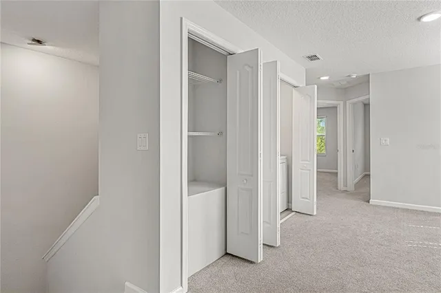 a view of a hallway with an empty room