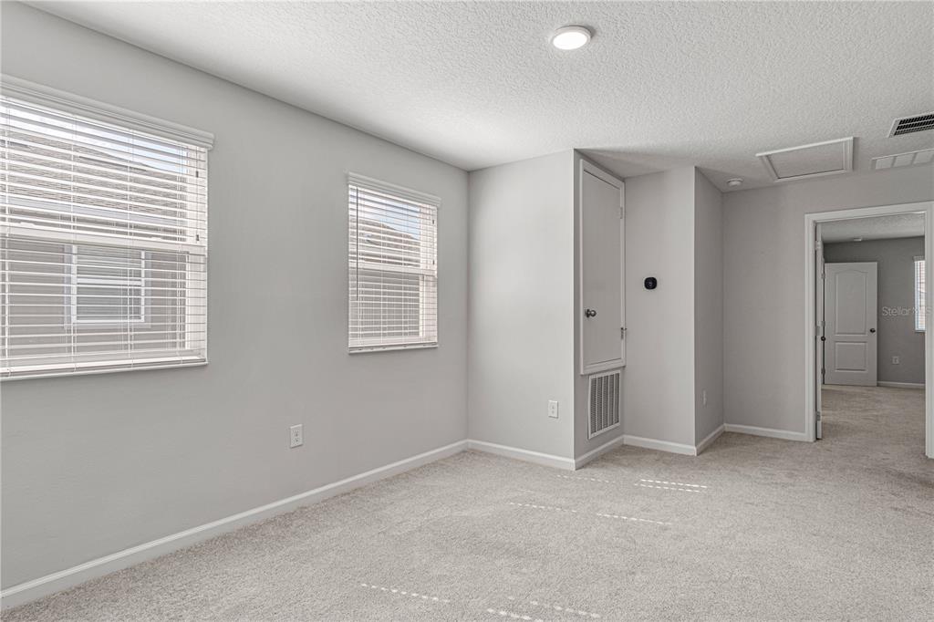 2875 Narcoossee Cmns Way St. Cloud, FL 34771 - Photo 19 of 50 a view of an empty room with a window