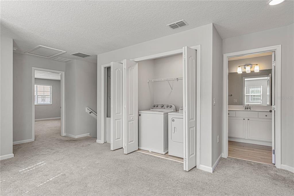 2875 Narcoossee Cmns Way St. Cloud, FL 34771 - Photo 20 of 50 wooden floor and closet in a room