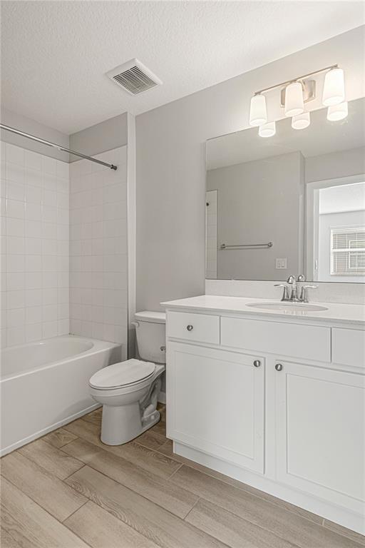 2875 Narcoossee Cmns Way St. Cloud, FL 34771 - Photo 27 of 50 a bathroom with a double vanity sink a toilet a mirror and shower