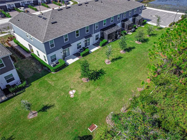 a aerial view of a house with a yard