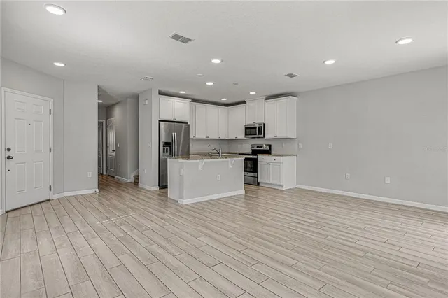 a view of kitchen with wooden floor