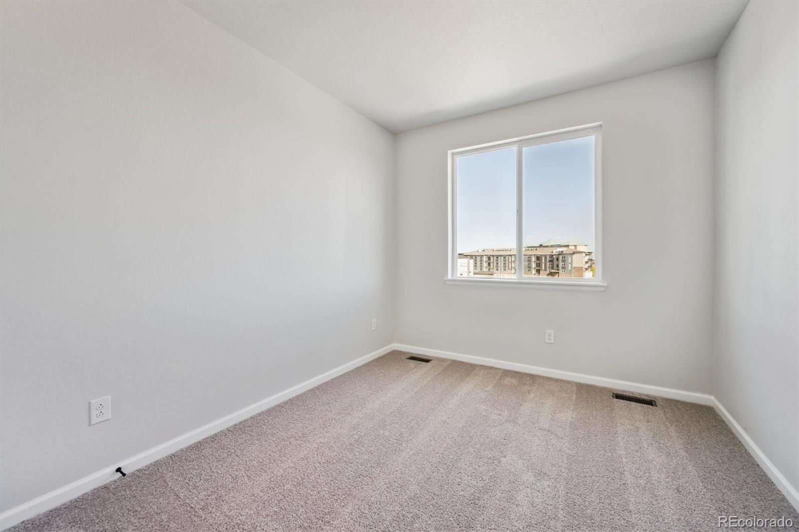 451 Interlocken Boulevard, Unit 101 Broomfield, CO 80021 - Photo 13 of 17 an empty room with a window