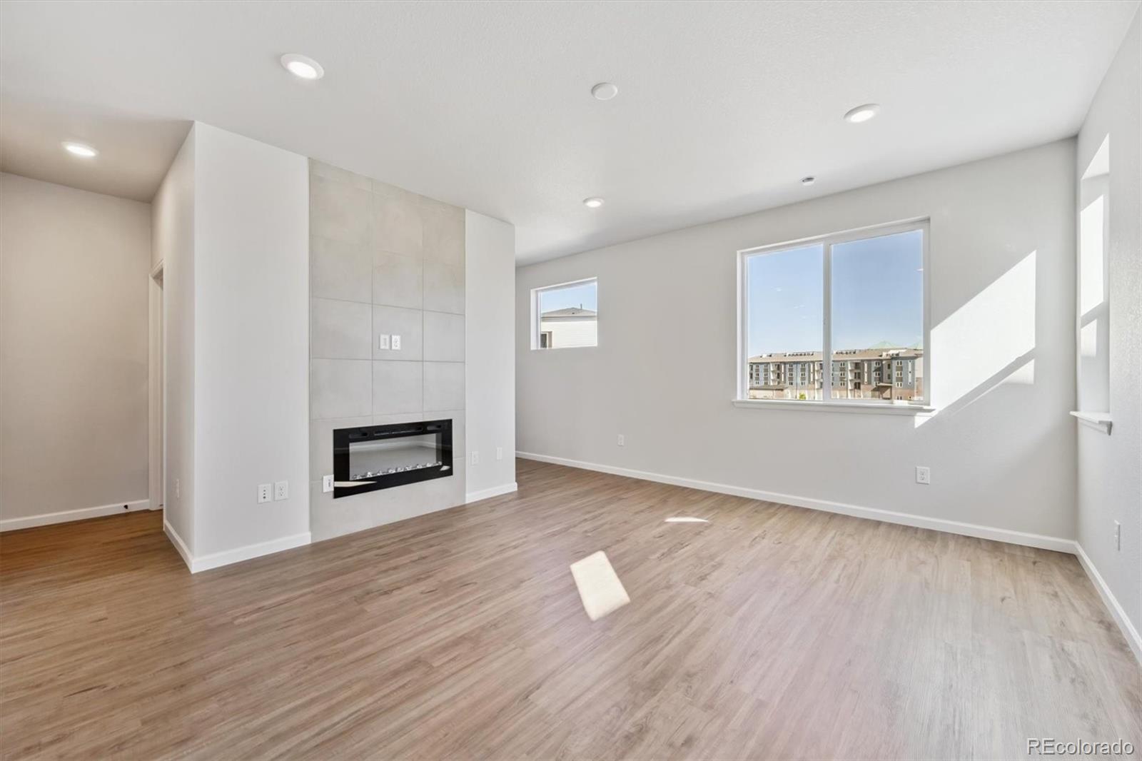 451 Interlocken Boulevard, Unit 101 Broomfield, CO 80021 - Photo 5 of 17 a view of a room with wooden floor and window