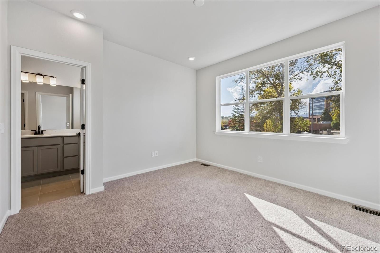 451 Interlocken Boulevard, Unit 101 Broomfield, CO 80021 - Photo 9 of 17 a view of an empty room with a window