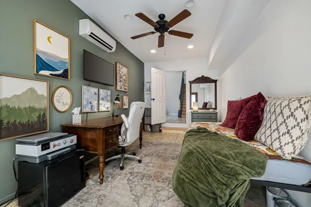a living room with furniture a rug and a chandelier