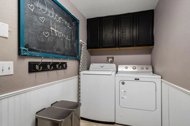 a utility room with dryer and washer