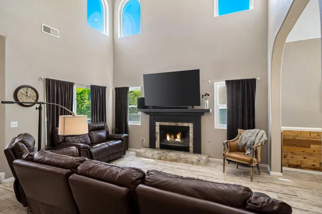 a living room with furniture and a fireplace