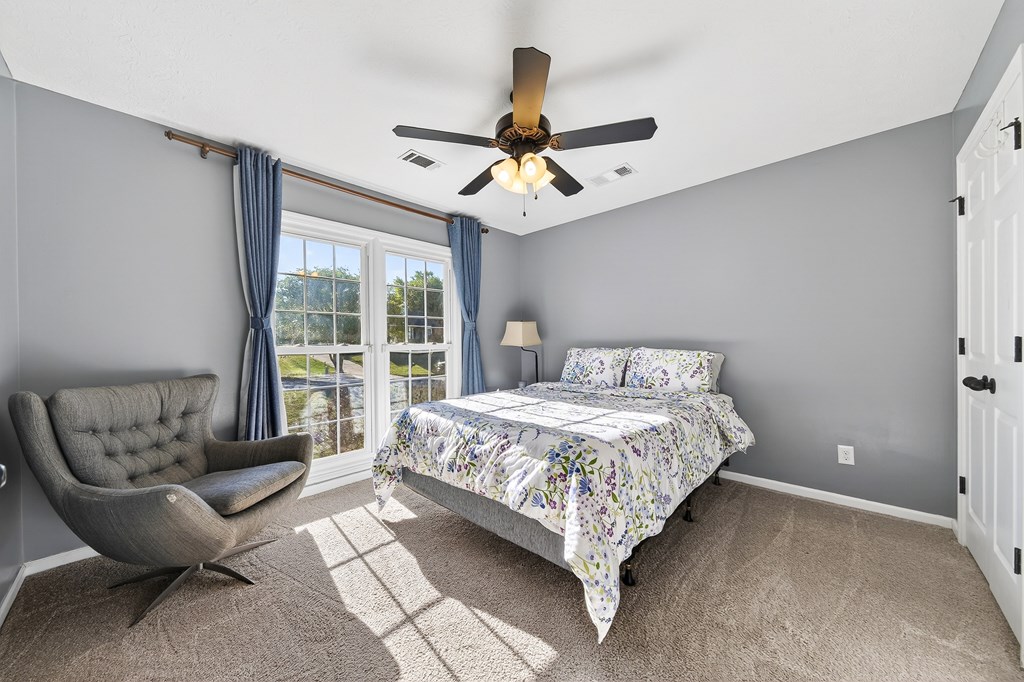 7333 Cedar Creek Loop Columbus, GA 31904 - Photo 22 of 37 a bedroom with a bed couch and window