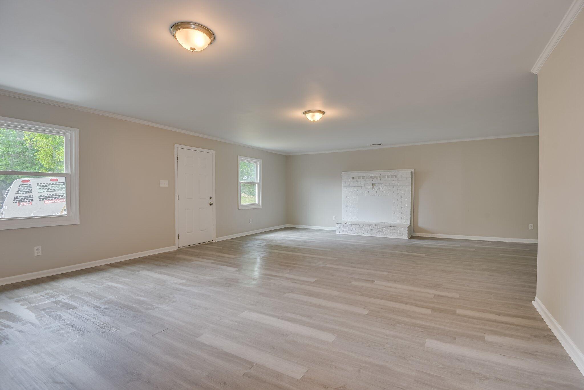 2115 Ashley Drive Augusta, GA 30906 - Photo 18 of 38 an empty room with wooden floor and windows