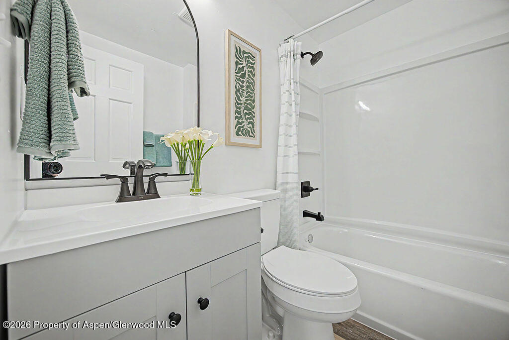 54 South Ranney Street Craig, CO 81625 - Photo 15 of 32 a bathroom with a sink a toilet and shower