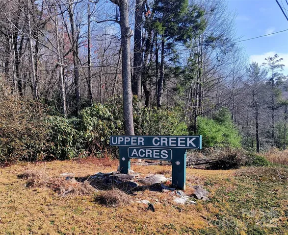 a wooden fence with trees