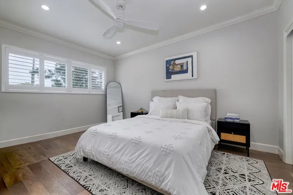 a bedroom with bed and a window