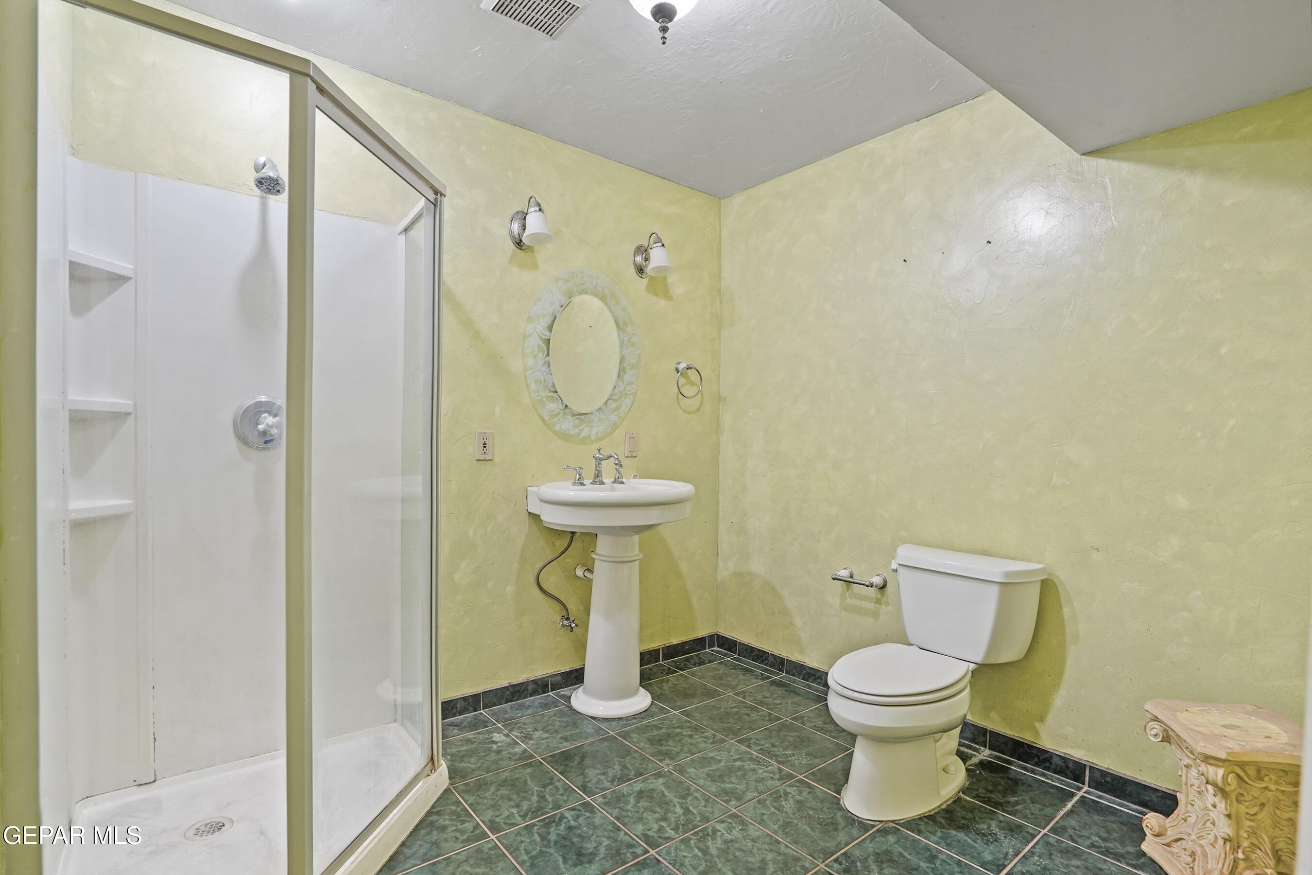 306 A Street Southwest Fabens, TX 79838 - Photo 11 of 37 a bathroom with a toilet sink and shower