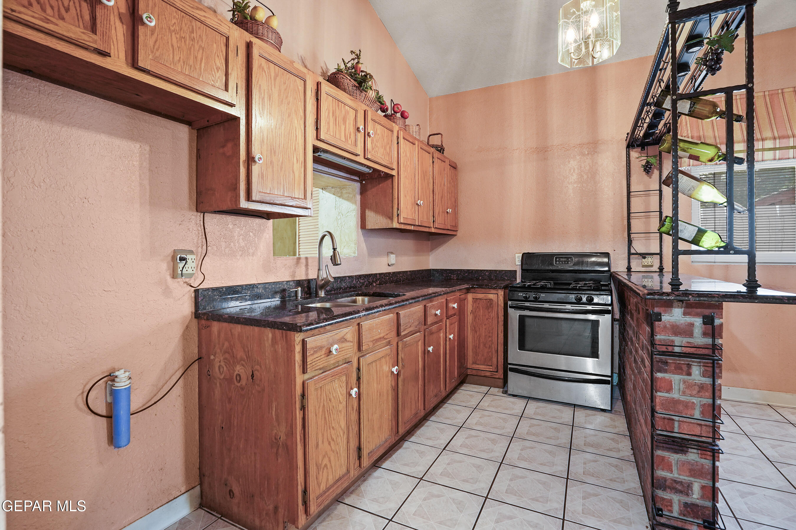 306 A Street Southwest Fabens, TX 79838 - Photo 14 of 37 a kitchen with stainless steel appliances granite countertop a stove and a sink