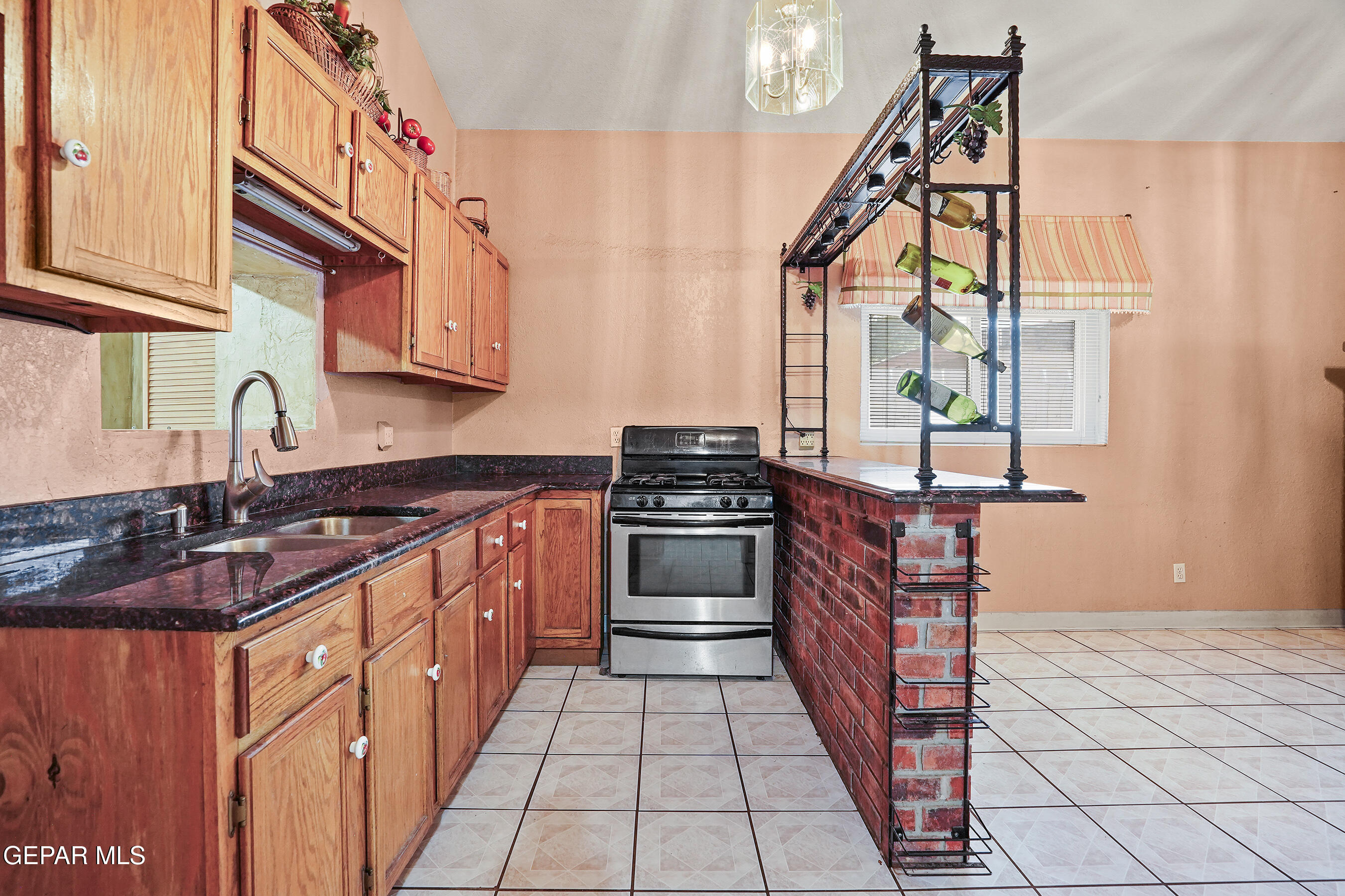 306 A Street Southwest Fabens, TX 79838 - Photo 15 of 37 a kitchen with stainless steel appliances granite countertop a stove and a sink