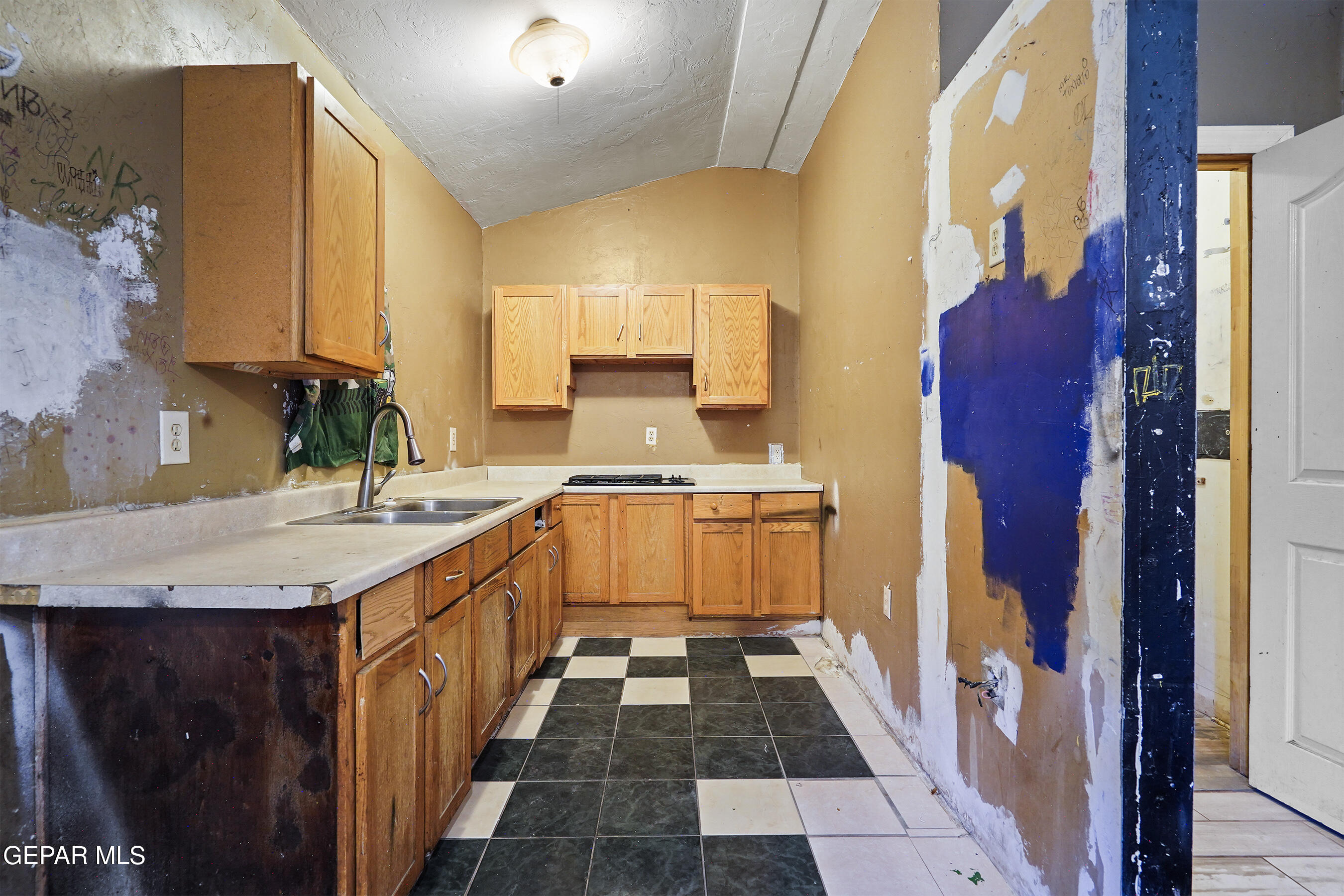 306 A Street Southwest Fabens, TX 79838 - Photo 34 of 37 a kitchen with sink a counter top space and cabinets