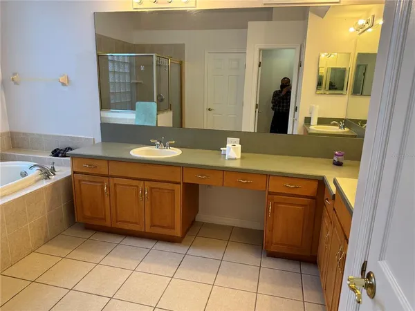 a bathroom with a sink a vanity and a mirror