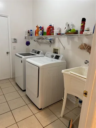 a utility room with dryer and washer