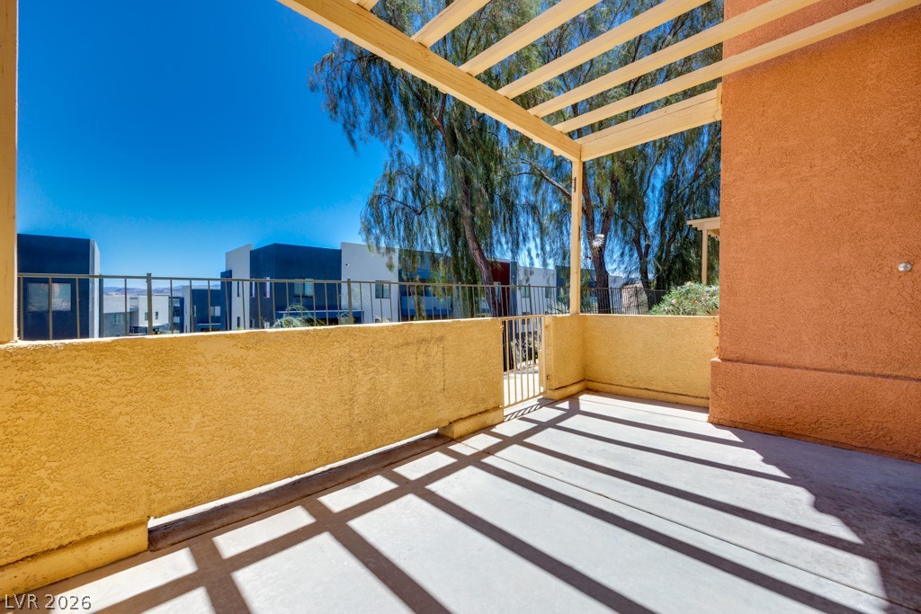 4915 East Russell Road, Unit 127 Las Vegas, NV 89120 - Photo 5 of 19 An inviting patio space features a pergola, offering both shade and architectural charm.