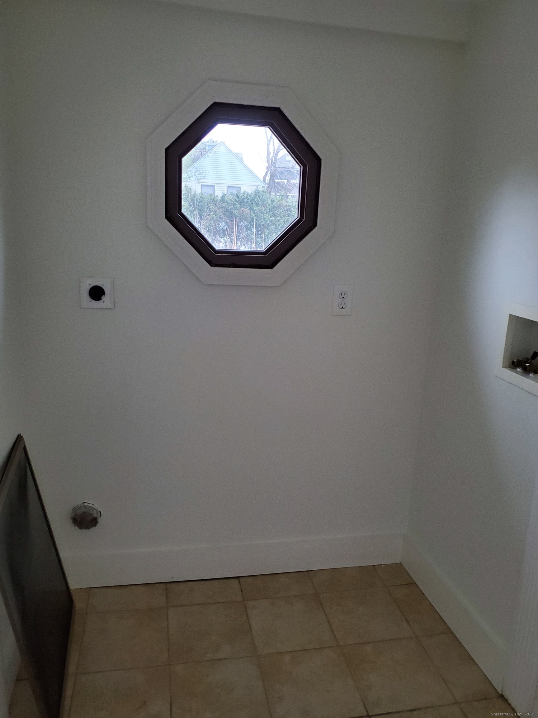 36 5th Street, Unit A Norwalk, CT 06855 - Photo 7 of 15 an empty room with a fan
