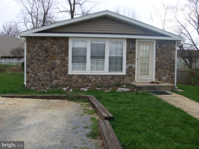 407 Lee Street Ranson, WV 25438 - Photo 1 of 6 a front view of a house with garden