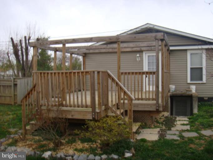 407 Lee Street Ranson, WV 25438 - Photo 2 of 6 a view of a house with backyard and wooden floor