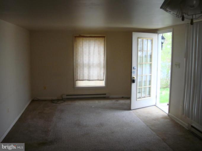 407 Lee Street Ranson, WV 25438 - Photo 4 of 6 an empty room with windows