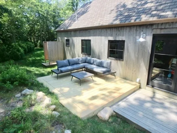a backyard of a house with seating space
