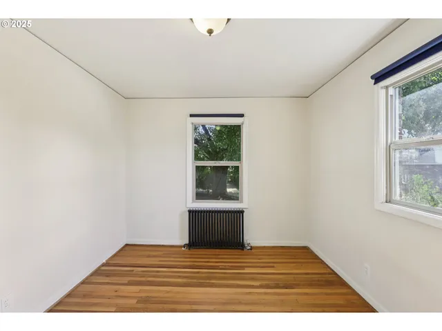 a view of empty room with windows