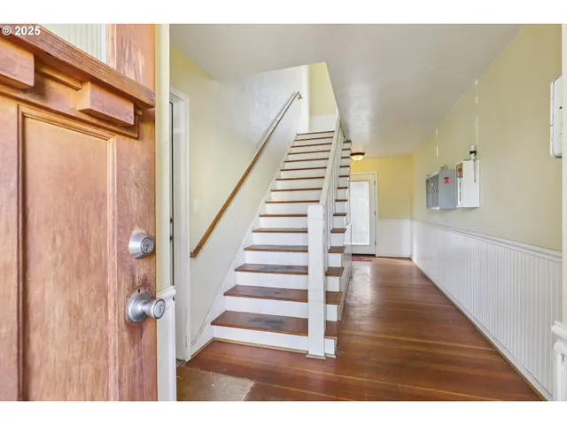 a view of entryway with wooden floor