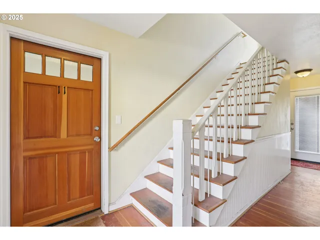 a view of entryway with wooden floor