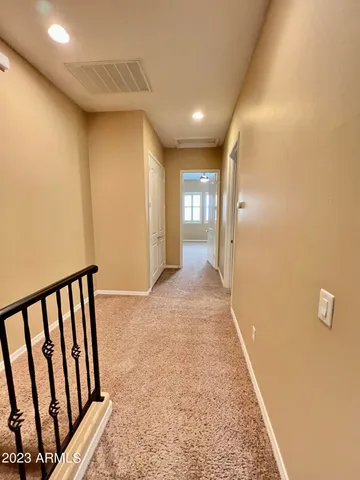 a view of hallway with stairs