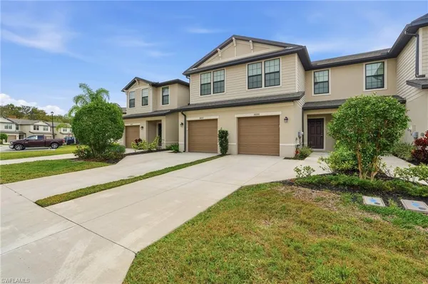 a front view of a house with a yard