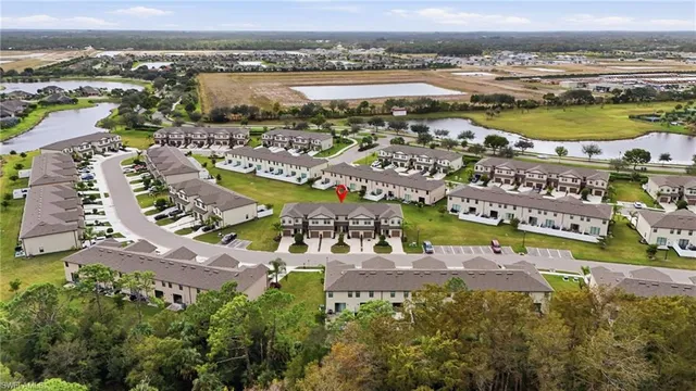 a front view of a house with a garden and yard