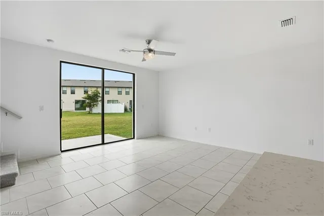 a kitchen with appliances a sink and cabinets