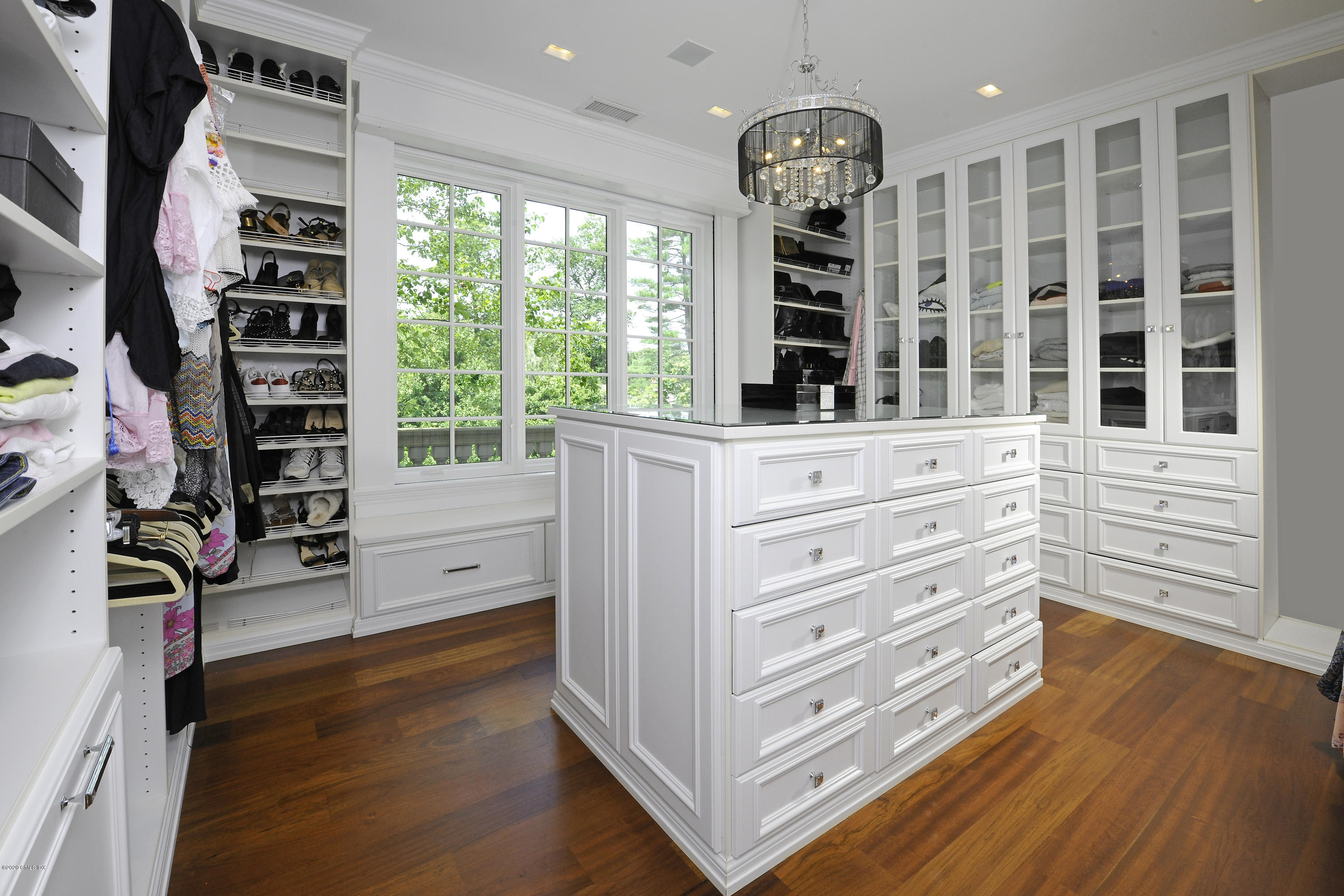 29 Doubling Road Greenwich, CT 06830 - Photo 19 of 26 a view of walk in closet with clothes and shoes