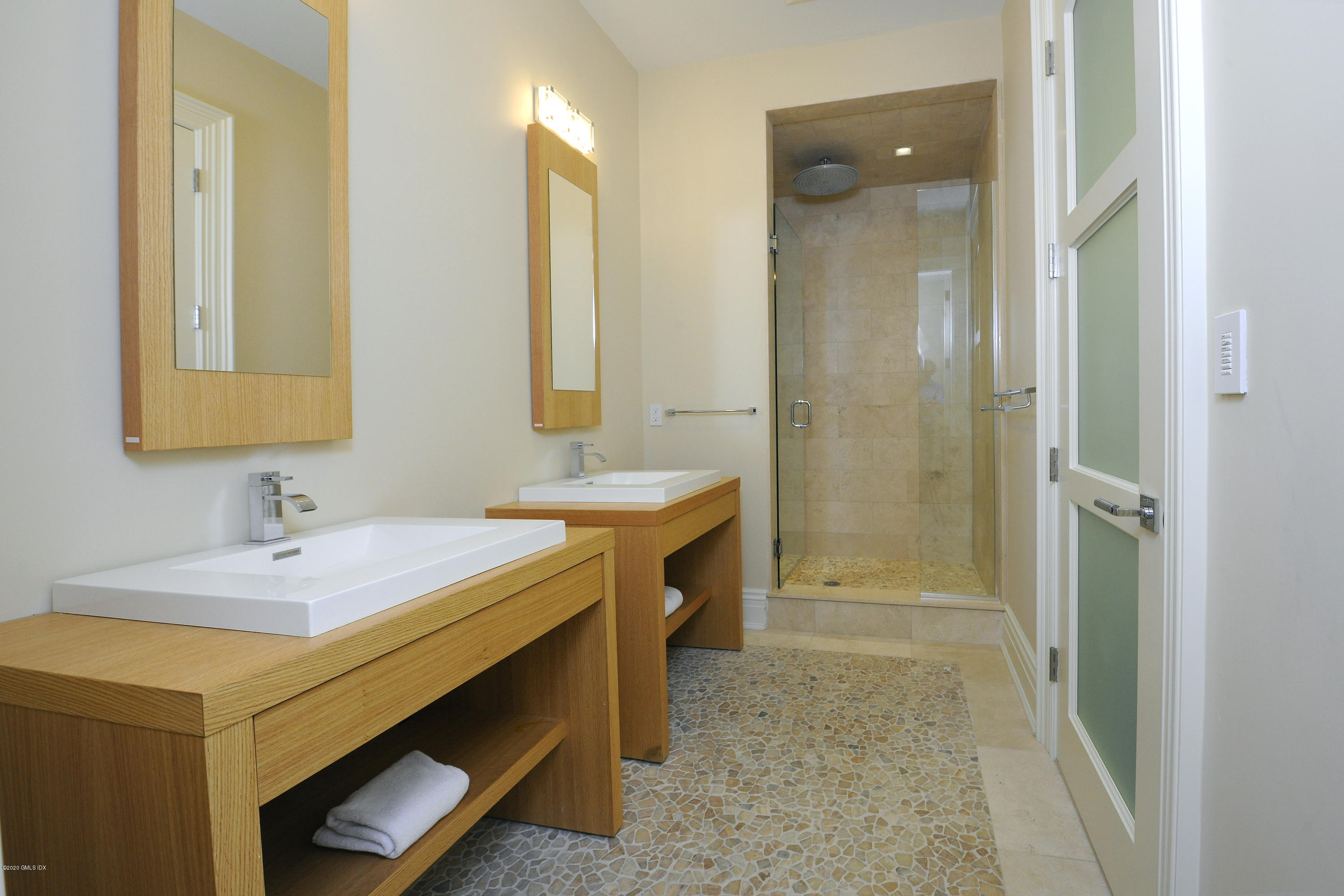 29 Doubling Road Greenwich, CT 06830 - Photo 23 of 26 a en suite bathroom with a sink double vanity and a mirror