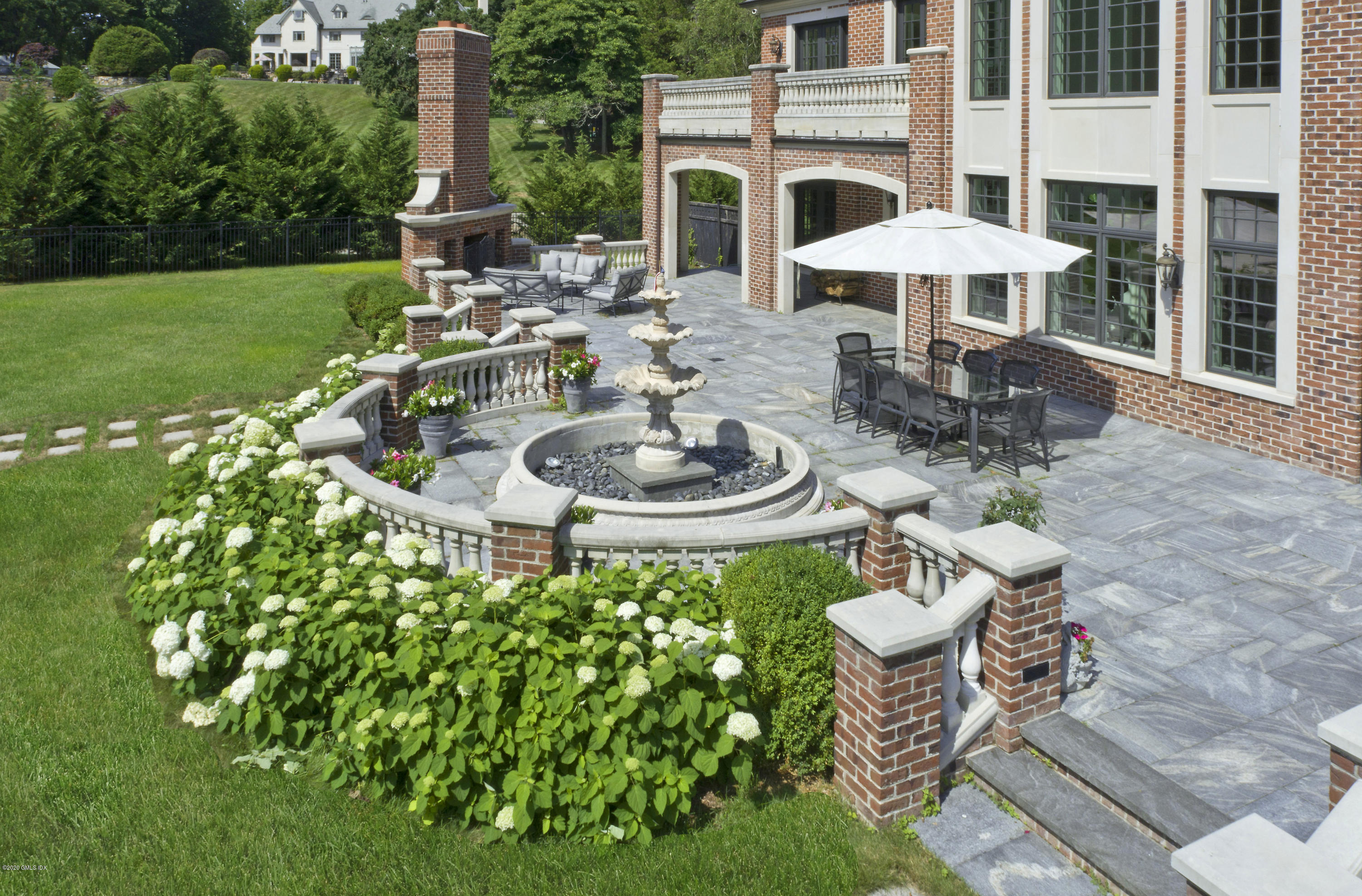 29 Doubling Road Greenwich, CT 06830 - Photo 24 of 26 a swimming pool with outdoor seating and yard