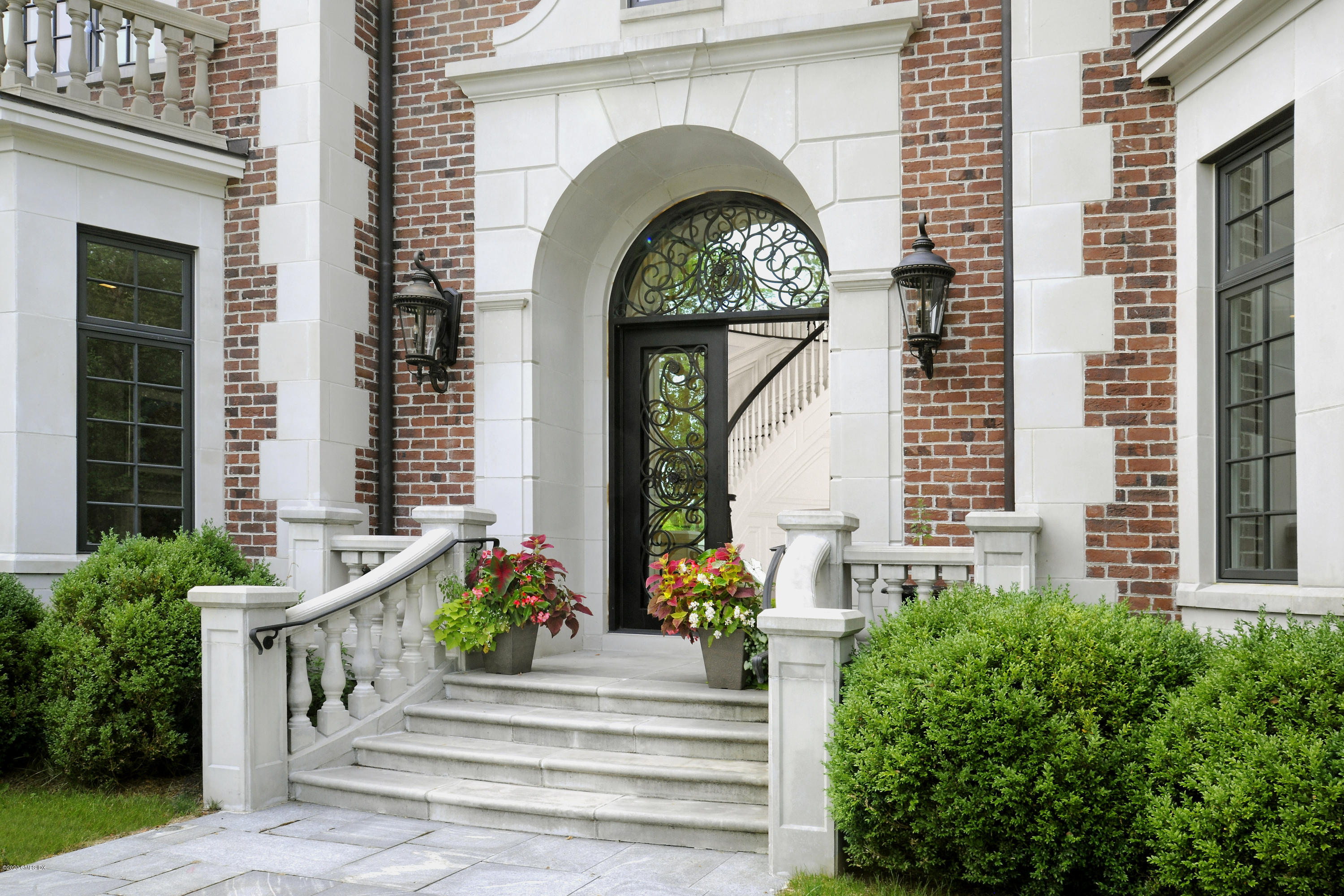 29 Doubling Road Greenwich, CT 06830 - Photo 3 of 26 a front view of a house with a garden