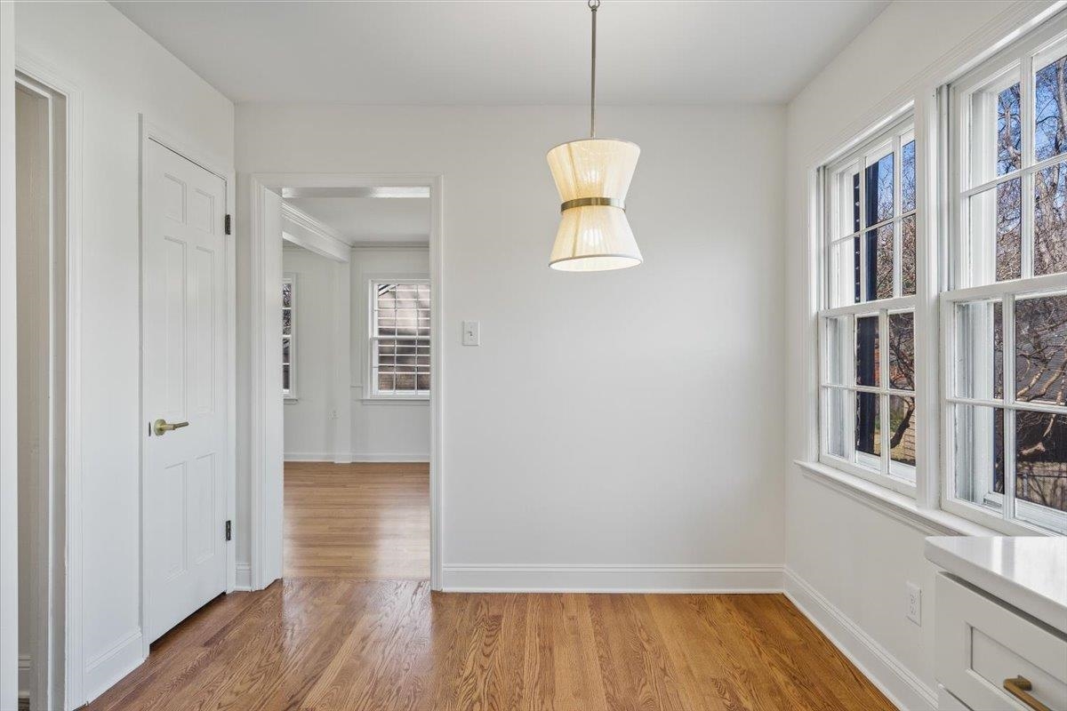 5600 Normandy Road Memphis, TN 38120 - Photo 11 of 28 Unfurnished dining area with light wood-type flooring and baseboards
