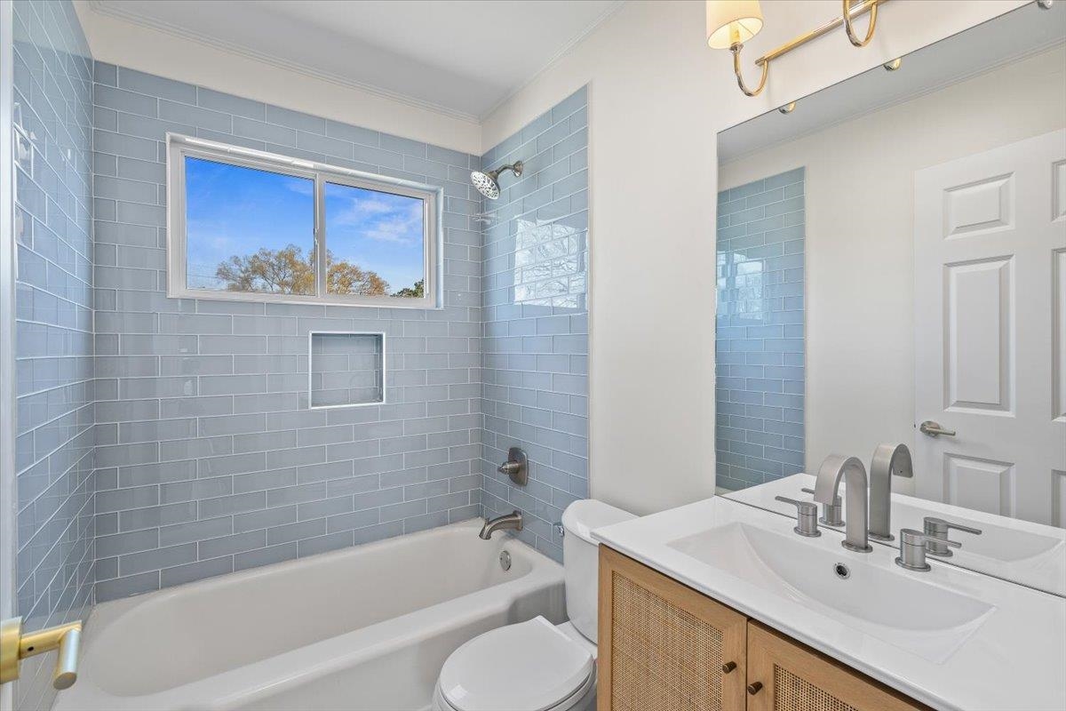 5600 Normandy Road Memphis, TN 38120 - Photo 23 of 28 Bathroom featuring vanity, ornamental molding, toilet, and shower / bath combination