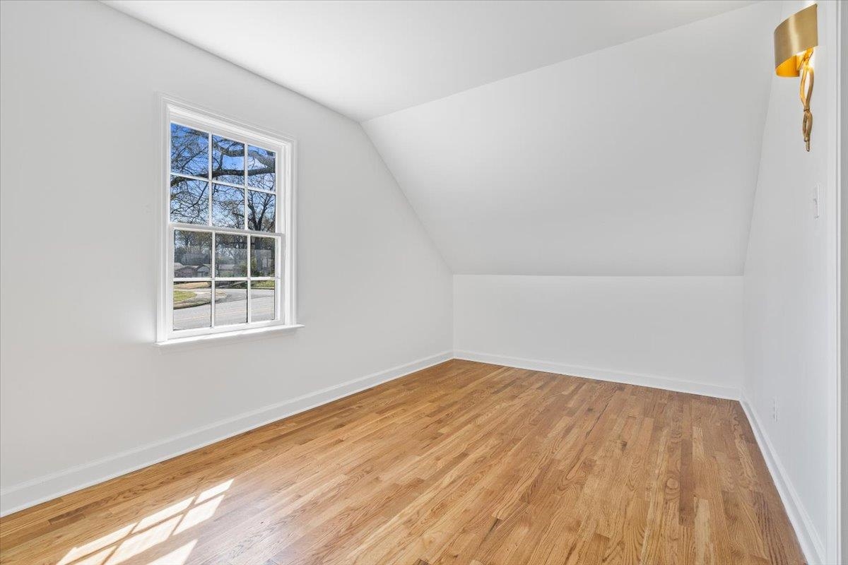 5600 Normandy Road Memphis, TN 38120 - Photo 27 of 28 Bonus room with light wood finished floors, lofted ceiling, and baseboards