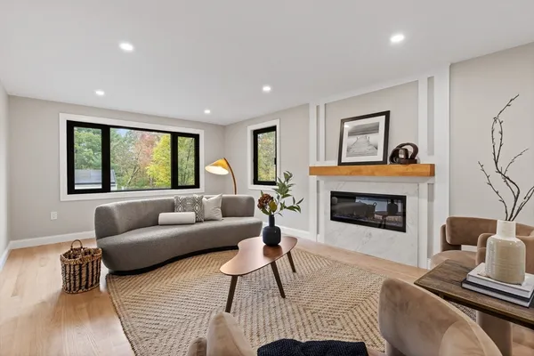 a living room with furniture and a fireplace