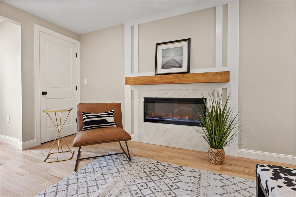 8 Mulberry Circle Ayer, MA 01432 - Photo 11 of 30 a living room with furniture and a fireplace