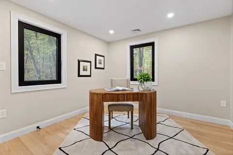 a workspace with furniture and window