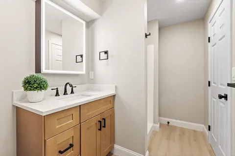 a bathroom with a sink and a mirror