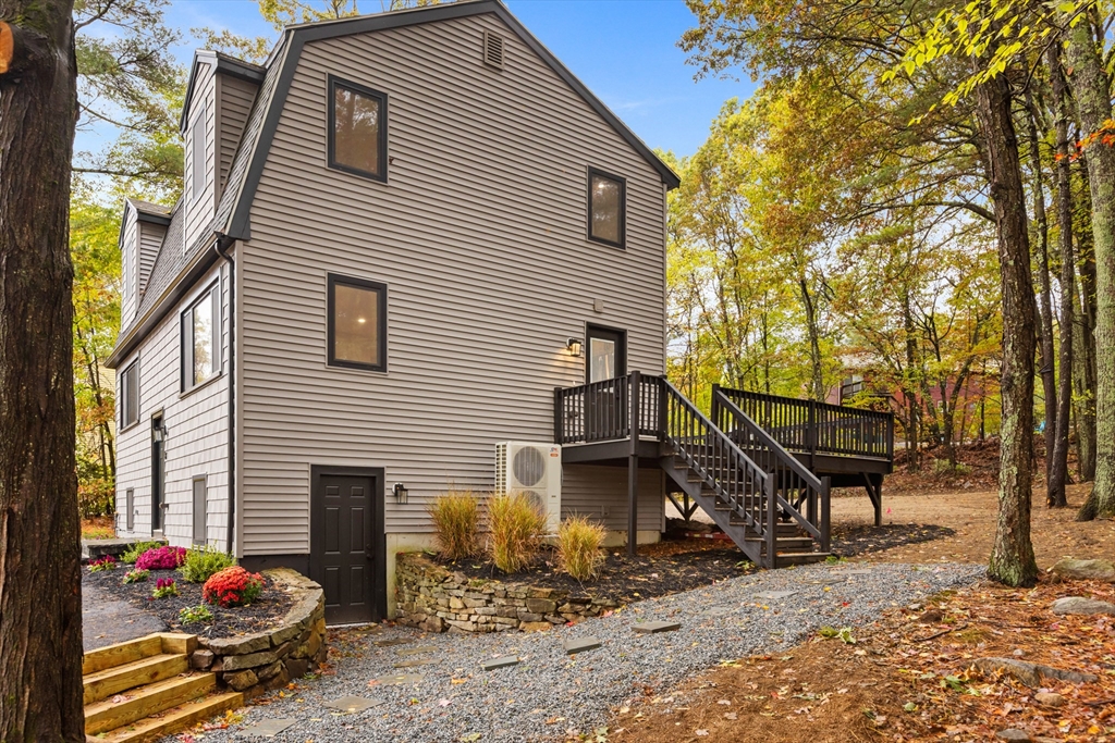8 Mulberry Circle Ayer, MA 01432 - Photo 28 of 30 a view of a house with a patio and a yard