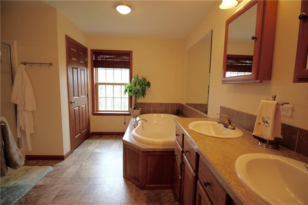 101 Pisor Road Hilliards, PA 16040 - Photo 8 of 25 Master Bath with double sinks, kidney tub, shower, and private toilet room.